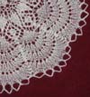 Doily of fine knitted wool